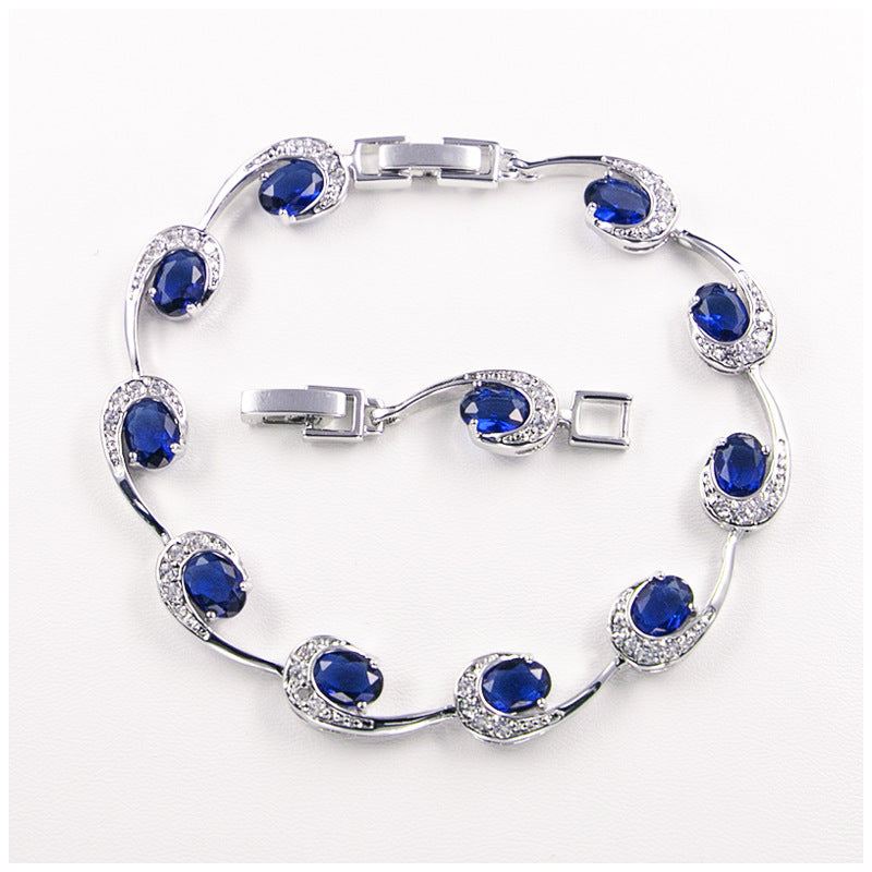 Elegant sapphire cubic zirconia swirl bracelet